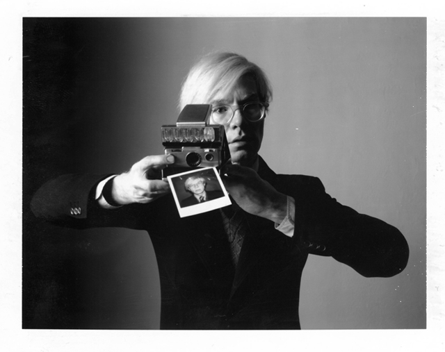 Andy Warhol with Polaroid SX 70